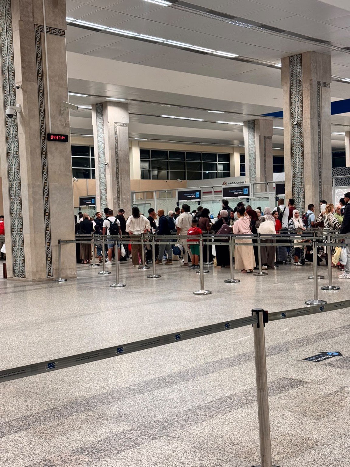 Passengers waiting in a queue inside Tangier Airport